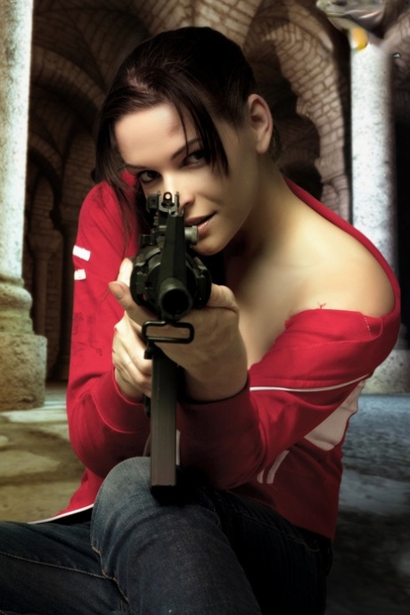 Brunette cosplayer releases her big tits while holding a rifle