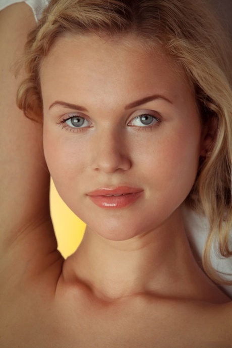 Blue-eyed teen Caroline Abel exposing her big ass and tits in a solo
