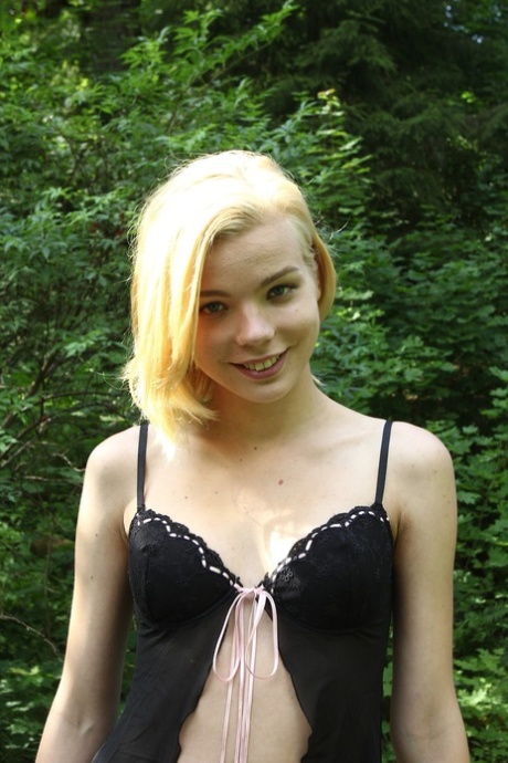 Platinum blonde sweetheart Sophia Kitten massages her bald cunt in nature